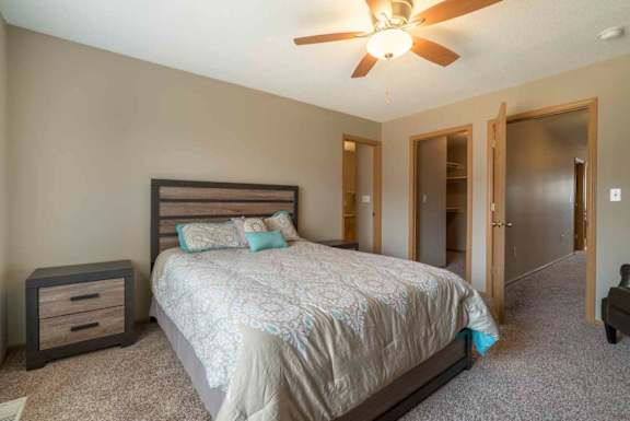 Master bedroom with walk-in closet and master bath at Southwind Villas in southwest Omaha in La Vista, NE, 68128