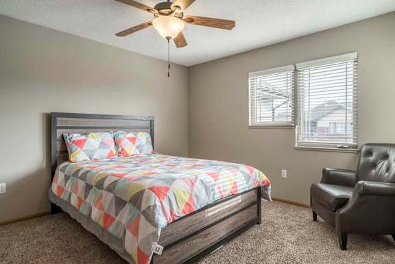 Second bedroom with ceiling fan at Southwind Villas in southwest Omaha in La Vista, NE, 68128