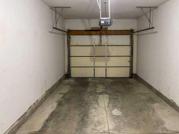 a garage with a close white garage door