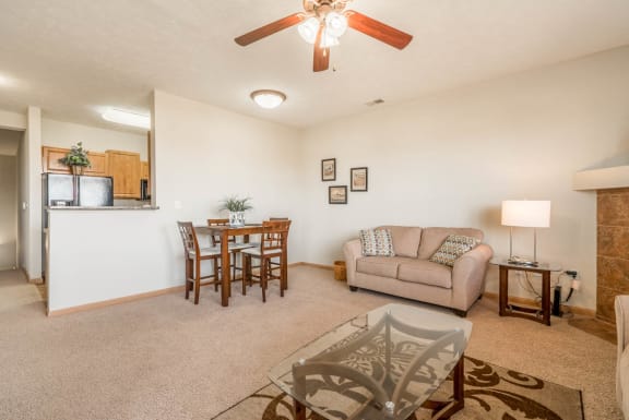 a living room and dining room with a couch and a table