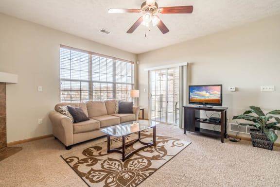 a living room with a couch and a tv