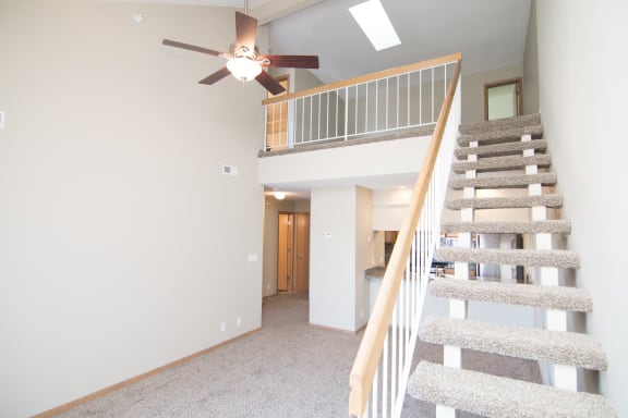 Loft style apartment with carpeted stairs at Skyline View Apartments in Southwest lincoln Ne