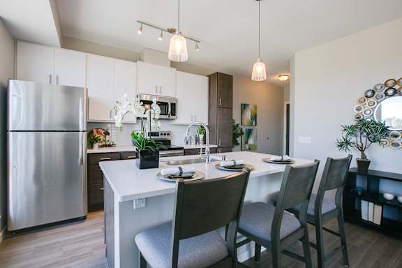 Kitchen with island and pendant lighting at The Central apartments near downtown Minneapolis MN 55408