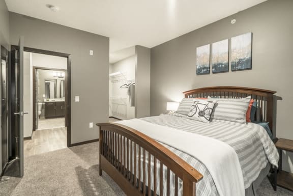 1-bedroom apartment with king-size bed and walk-in closet at The Conrad in Blackstone District Omaha