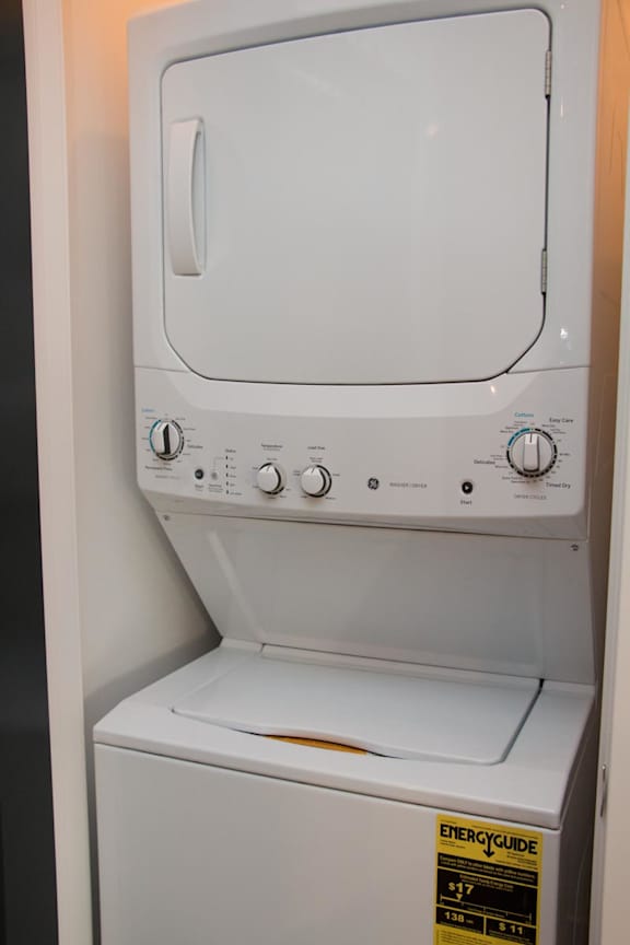 Stacked washer and dryer unit in a closet