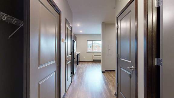 an entryway with closet doors on both sides