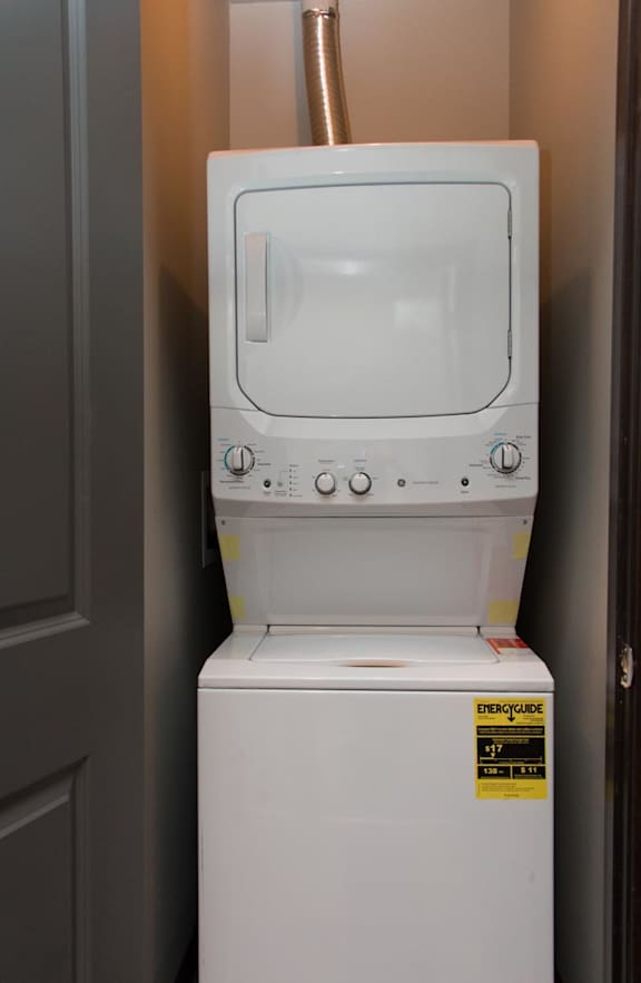 Stacked washer and dryer in a closet