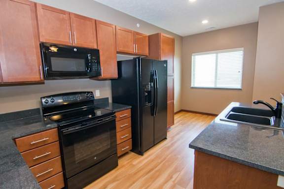 A kitchen with black appliances