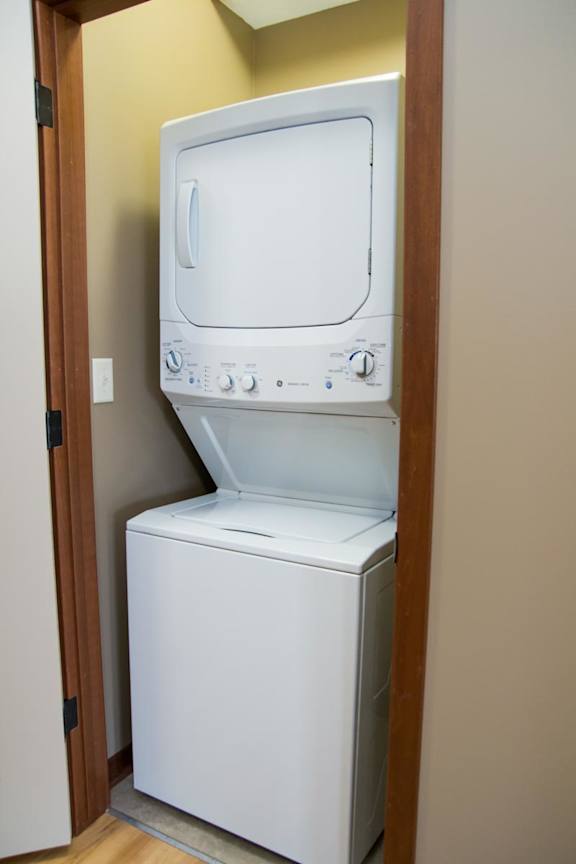 Stacked washer and dryer in a closet