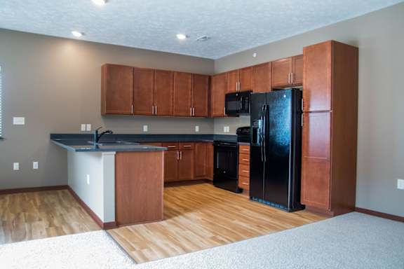 U-shaped kitchen with black appliances