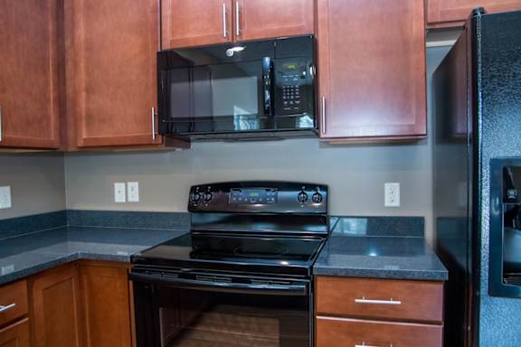 Black oven with a black microwave above it