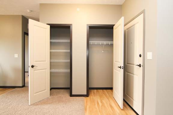 2 closets with open doors