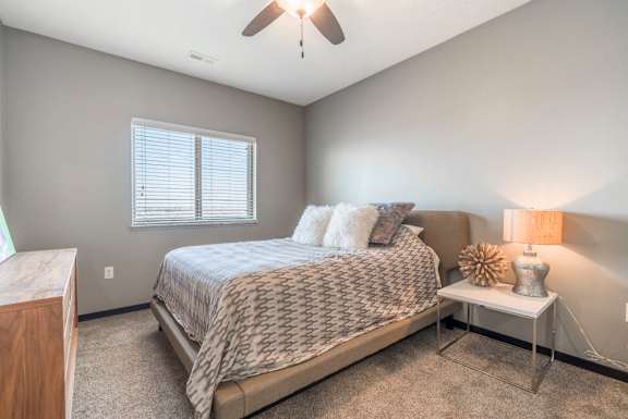 Living room with ceiling fan at The Flats at 84 in southeast Lincoln NE 68516
