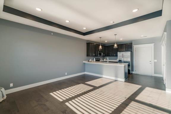 A spacious kitchen with a bar area and a large island.