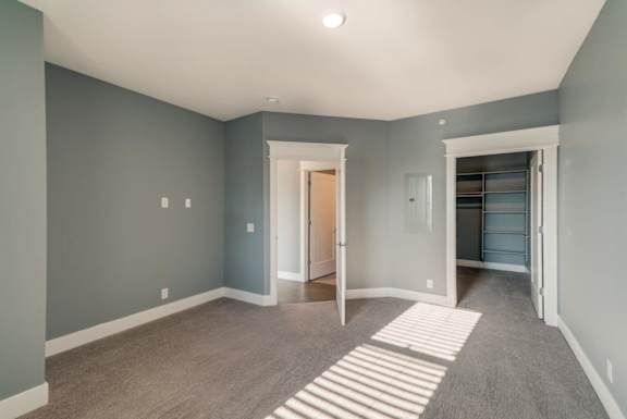 A room with a striped rug on the floor.
