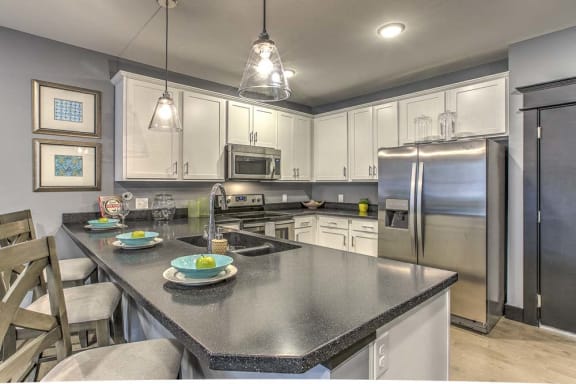 Counter top seating and view of the kitchen at The Helen
