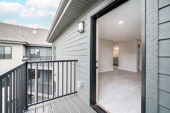 The door to the balcony with exterior lighting and outlets