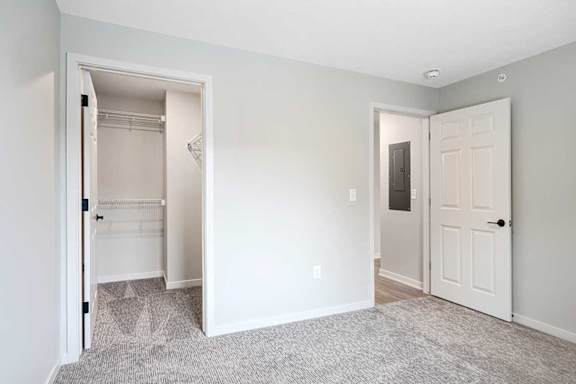 The second bedroom in the Dove floorplan featuring the walk-in closet with built-in shelving