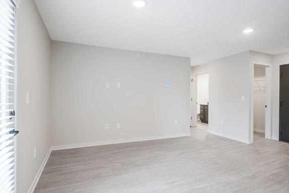 A living room with light luxury vinyl hardwood floors