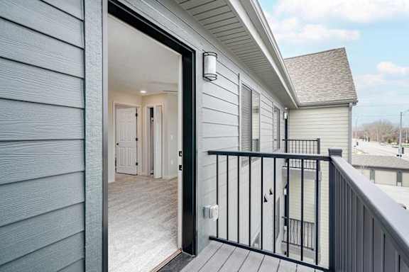 the balcony with exterior lighting and electrical outlet