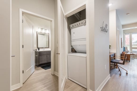 View of bathroom, laundry and living room at The Preserve at Normandale Lake in Bloomington, MN
