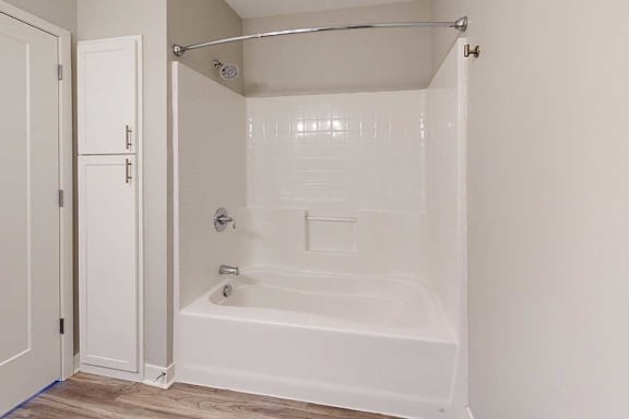 A bathroom with a tub shower.