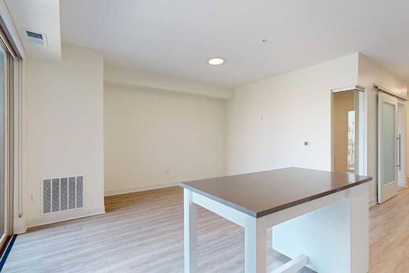A living room and kitchen with an island