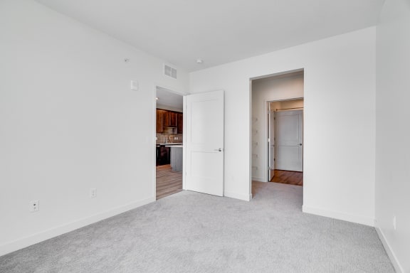 Spacious carpeted bedroom with walk in closet at The Rowan in Eagan Minnesota