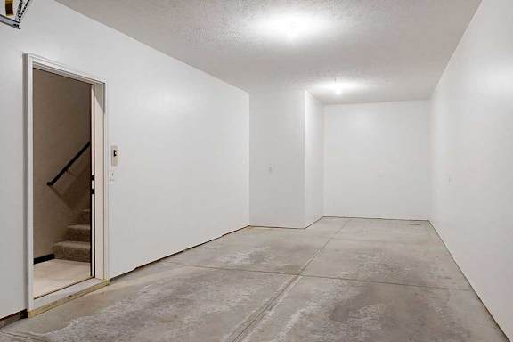 A two-car tandem garage directly attached to an apartment.