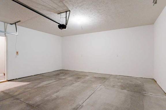 A two-car double garage with a door leading directly to the apartment.