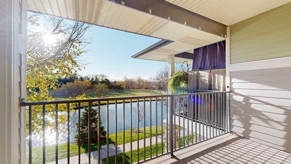 the view from the balcony overlooking a pond