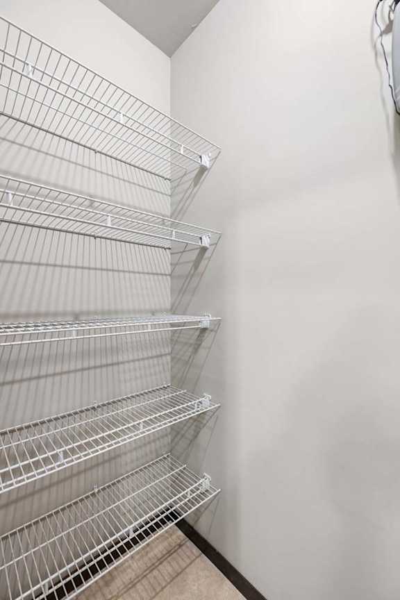 Empty shelves in a white room.