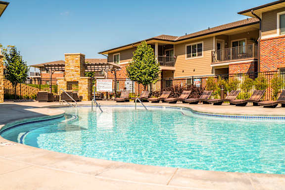 resort style swimming pool outside the clubhouse at The Villas of Omaha at Butler Ridge