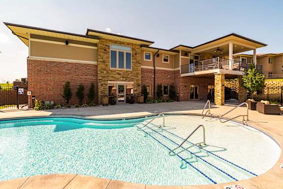 resort style swimming pool outside the clubhouse at The Villas of Omaha at Butler Ridge