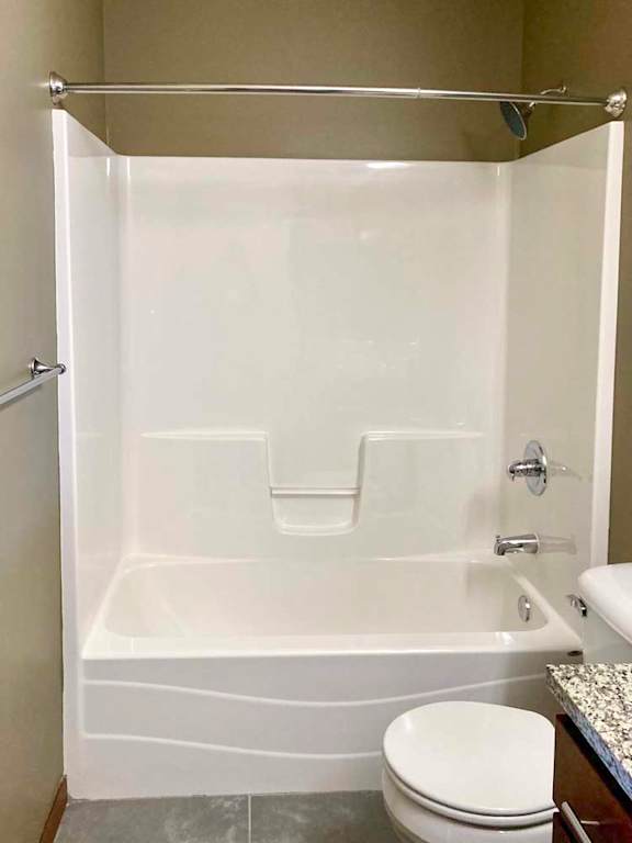 A white tub shower with chrome fixtures