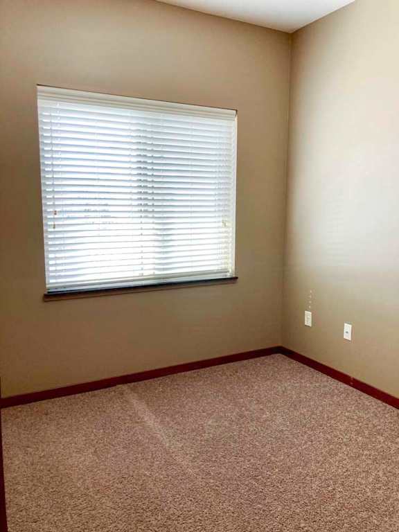 A den space with a large window.