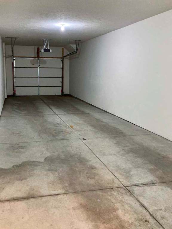 An attached two-car tandem garage.