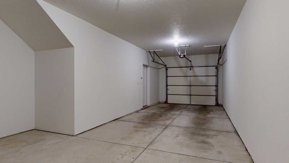 a two-car tandem garage with an extra nook for storage