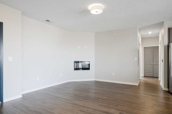 a living room with luxury vinyl wood floors and a fireplace