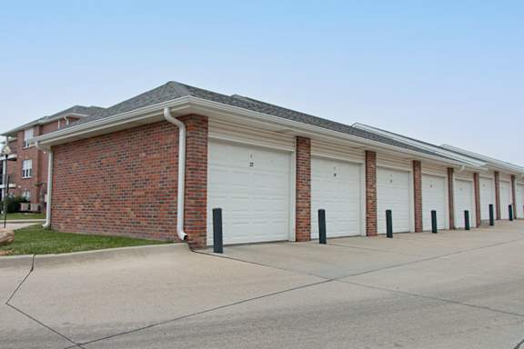 A long building with a row of garage doors