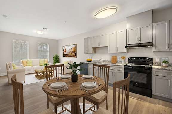 A modern kitchen with a dining table set for two.