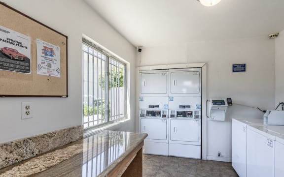 a kitchen with a counter top and appliances and a door