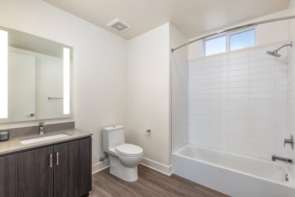 an empty bathroom with a toilet and a bath tub