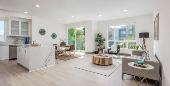 a living room with a kitchen and a dining room