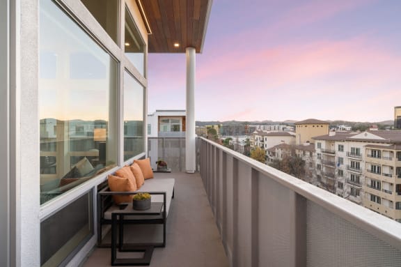 a balcony with a view of the city and the city skyline