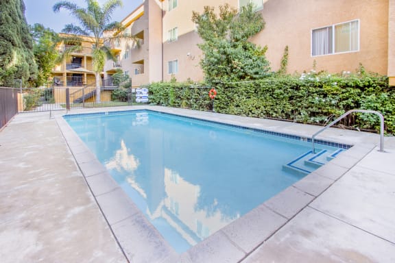 the swimming pool with greenery at Dronfield Astoria Apartments, California, 91342