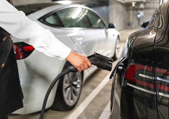 A person is charging an electric car.