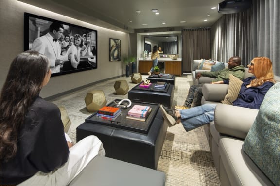a living room filled with furniture and a large flat screen tv