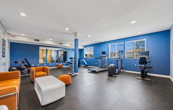 a workout room at the bradley braddock road station apartments