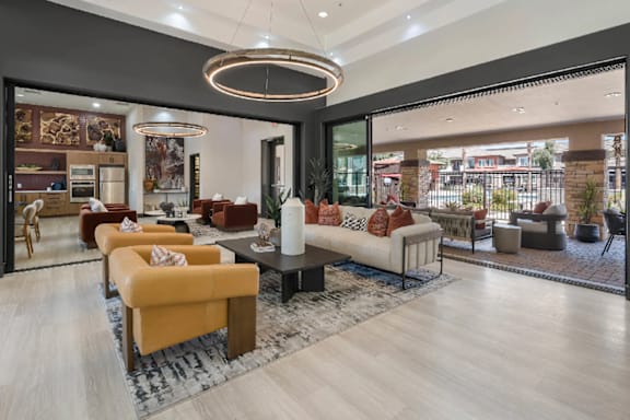 A modern living room with a yellow sofa and a black coffee table.